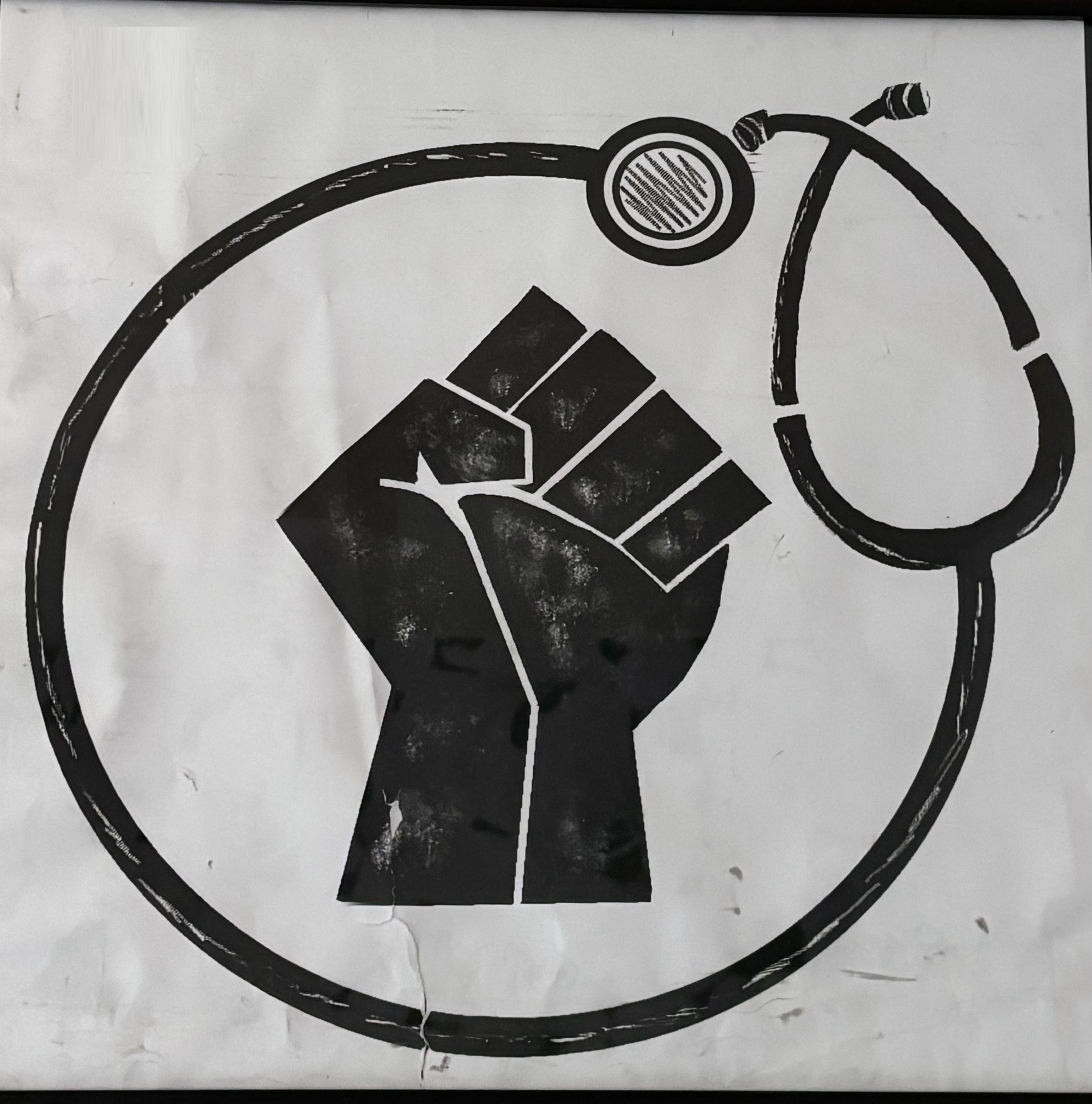 Raised fist encircled by a stethoscope